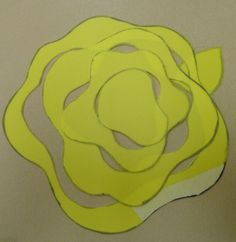 yellow paper cut out to look like a rose