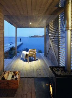 a room with wooden floors and a chair on the floor next to an open fire place