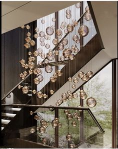 a staircase with glass balls hanging from it