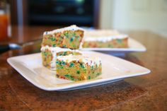 two pieces of cake sitting on top of a white plate