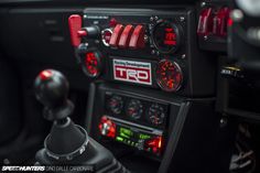 the interior of a car with various gauges and dash lights