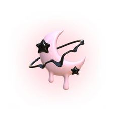 a pink and black crescent with stars on it's side is floating in the air