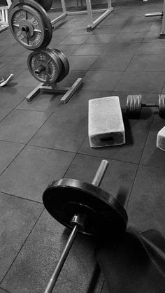 the gym floor is clean and ready for someone to do some exercises with their weight