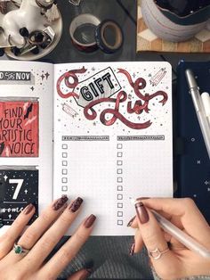 a woman is holding a pen and looking at a notebook with some writing on it