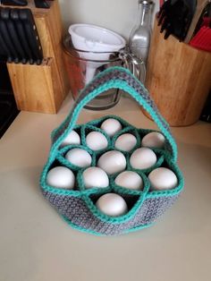 a crocheted bag filled with eggs sitting on top of a counter