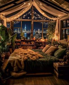 a bedroom with lights strung from the ceiling and curtains on the window sill over the bed