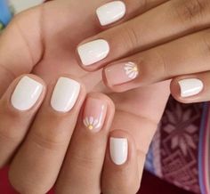 a woman's hands with french manies and flowers on them