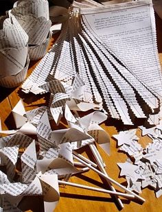 several pieces of folded paper sitting on top of a table