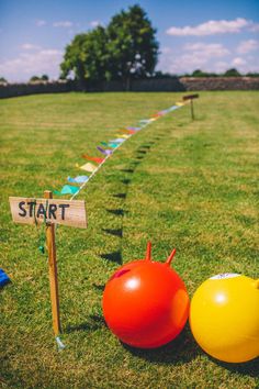 Red and yellow bouncy hoppers on a large green yard for wedding garden games Giant Garden Games, Outdoor Wedding Games, Diy Carnival Games, Fun Wedding Games, Garden Wedding Games, Wedding Party Games, Space Hopper, Festival Games