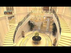 the inside of a building with chandeliers and stairs