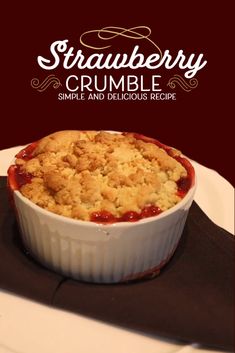 strawberry crumble is in a white dish on a black plate with the words strawberry crumble