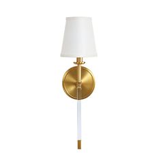 a wall light with a white shade on the side and a gold metal frame around it