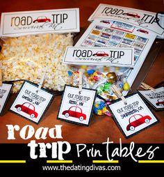 the road trip printables are on display with popcorn and candies in them