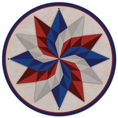 a red, white and blue star is in the center of a circular design on a wall