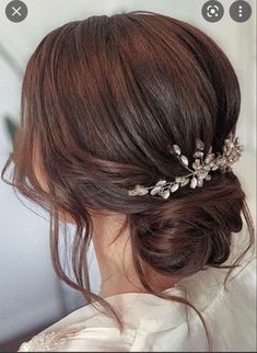 a woman wearing a hair comb with flowers in her hair