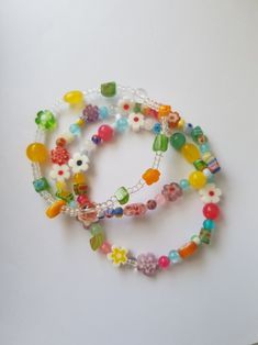 multicolored beaded bracelets on white surface