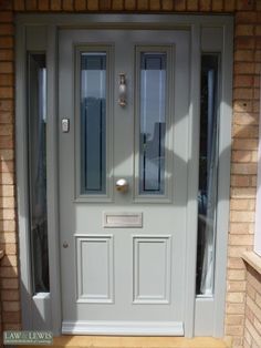 a white front door with two windows