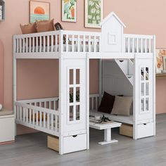 there is a white bunk bed with stairs on the bottom level and a desk underneath it