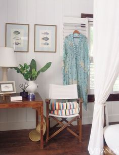 a white chair sitting next to a wooden table