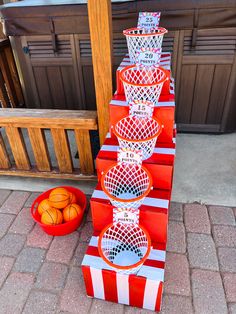 several basketballs are stacked on top of each other in front of a basket ball stand