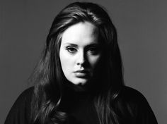 a black and white photo of a woman with long hair