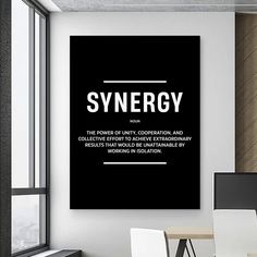 a black and white poster with the words synergy on it in front of a desk