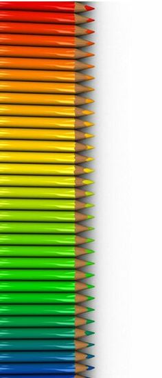 the rainbow colored pencils are lined up in rows