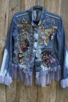 an old jean jacket with flowers on it