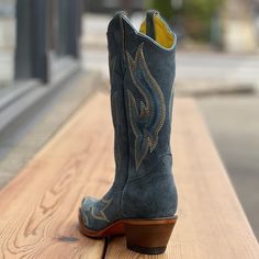 FREE SHIPPING & RETURNS ON ALL CONTINENTAL US ORDERS Brand new addition to Planet Cowboy's Psychedelic Collection! Bringing back the vibe of the 1970's – fun, cool, playful, and nostalgic. This is a great boot for all seasons, designed exclusively by Planet Cowboy. This gorgeous rough-out steel blue suede boot has light blue piping, yellow interior lining, and expressive stitching. 12" Tall Pointy Snip Toe 1 3/4" Stacked Leather Heel Genuine Rough-Out Leather in Steel Blue 8 Row Stitch Patte Blue Cowboy Boots, Custom Cowboy Boots, Blue Suede Boots, Western Shoes, Yellow Interior, The Vibe, Shades Of White, Zambia, Blue Suede