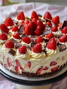 a cake with white frosting and strawberries on top