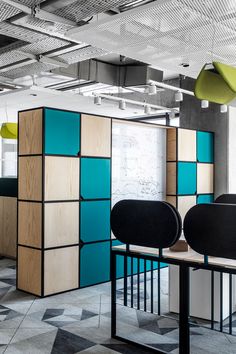 an office cubicle with several different colored panels