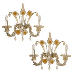 a pair of gold and crystal wall sconces, circa to mid 20th century