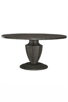 an oval dining table with two pedestals on each side and a circular base at the end