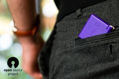 a purple object is in the pocket of a man's pants
