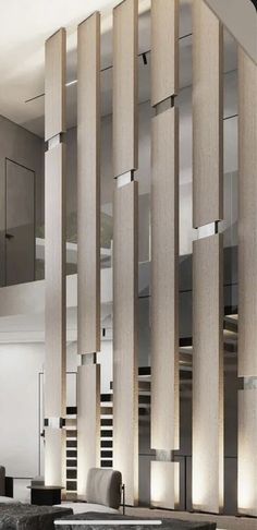 the interior of an office building with wooden columns and glass partitions on the walls