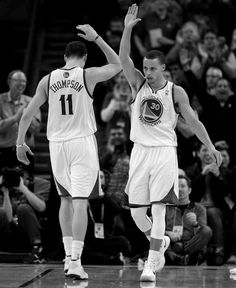 two basketball players giving each other high fives in front of an audience with the words calm down, y'all we got this way