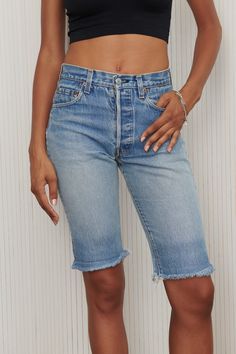 Softened long cut off denim shorts made from the most perfect fitting Levi’ 501 Jeans. Channel your inner Kendall Jenner in these shorts and get ready for summer! Features frayed hem and faded medium wash. 100% Cotton. Listed size 29. Fits like 27/28- Waist: 28" - Hips: 36" - Length: 20.5" - Inseam: 12" Kendall Jenner, Levi 501 Jeans, Levi 501, Cut Offs, Long Cut, 501 Jeans, Levi Jeans 501, Vintage Denim, Clothes Pins