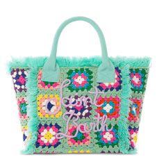 a green handbag with flowers and the words love is in the air on it