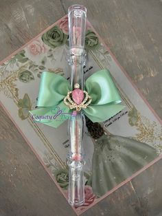 a pink and green pen with a heart on it