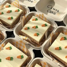 there are many small trays that have carrot cake in them on the table together