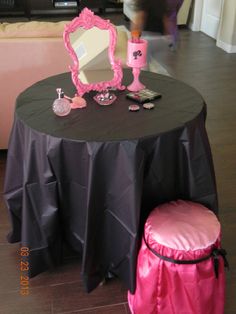 an image of a table with pink decorations on it