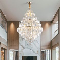 a large chandelier hanging from the ceiling in a living room