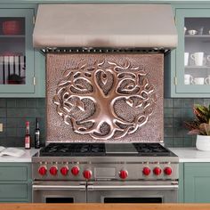 a stove top oven sitting inside of a kitchen next to a wall mounted oven hood