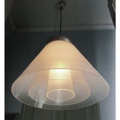 a lamp hanging from the ceiling in a room