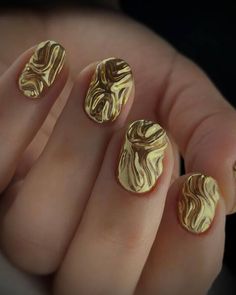 Golden Swirl Enigma: This nail design is truly a work of art, featuring golden swirls over a glossy black base that capture the luxurious essence of autumn. The swirls are created with a marbling technique that results in a unique pattern on each nail, offering an exclusive and custom look that’s perfect for those seeking a bold and artistic expression this season.