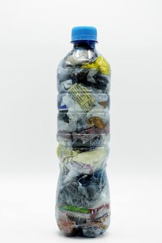 a plastic bottle filled with lots of garbage
