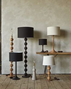 three lamps are sitting next to each other on the floor