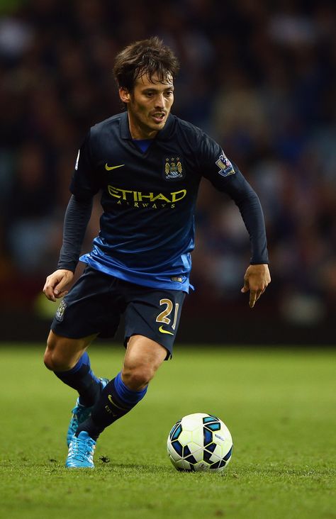 David Silva of Manchester City in action during the Barclays Premier League match between Aston Villa and Manchester City at Villa Park on October 4, 2014 in Birmingham, England. Aston Villa Fc, David Silva, Villa Park, James Rodriguez, Premier League Matches, Birmingham England, Football Boys, Soccer Player, Aston Villa