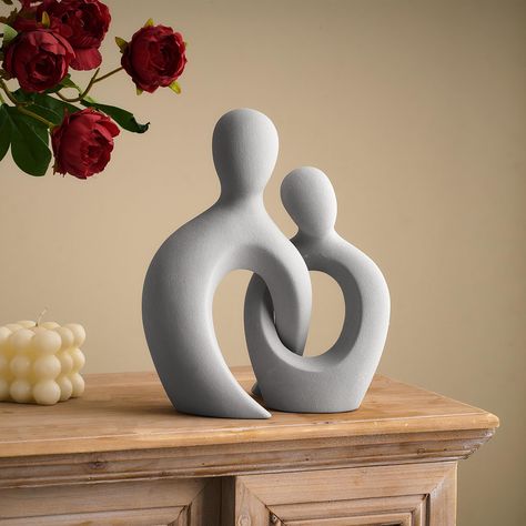 PRICES MAY VARY. 💞 EXUDING ROMANCE: The abstract sculpture is hollowed out and the crossed parts resemble a couple snuggling together, symbolizing wonderful love and companionship, and eternal love to old age. 💞 QUALITY MATERIALS: Made of high quality ceramic carefully fired, the surface is frosted to make it look more unique, it can be wiped clean with a soft cotton cloth, and there is a whole sponge cushion at the bottom, which is smooth to place and will not damage the desktop. 💞 EXQUISITE Modern Clay Sculpture, Cute Couple Clay Art, Clay Sculpture Abstract, Surface Decoration Ceramics, Abstract Ceramic Sculpture Ideas, Abstract Sculpture Clay, Abstract Clay Art, Love Sculpture Art, Abstract Clay Sculpture
