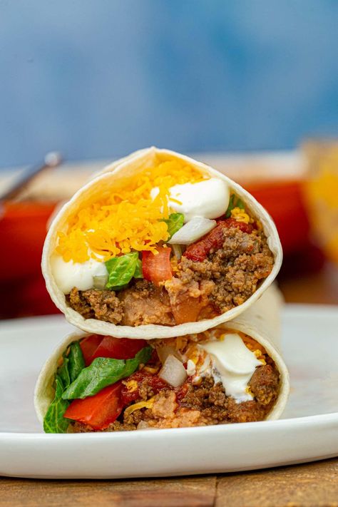 Taco Bell Burrito Supreme (Copycat) is an easy make at home recipe for one of Taco Bell's best menu items. With beans, beef, red sauce and cheddar cheese. #dinner #tacobell #burrito #copycatrecipe #mexicanfood #burritosupreme #groundbeef #dinnerthendessert Essen, Burritos Recipe Beef, Best Ground Beef Burrito Recipe, Best Beef Burrito Recipe, Taco Burritos Ground Beef, Ground Beef Burritos Recipe, Taco Burrito Wrap, Burrito Ideas Dinners, Copycat Taco Bell Burrito Supreme